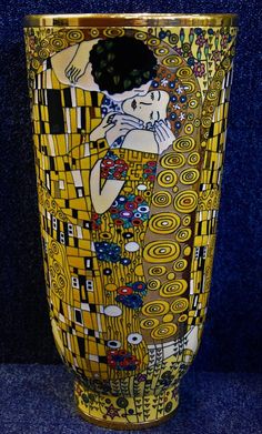 the vase is decorated with an image of a woman hugging a man's head