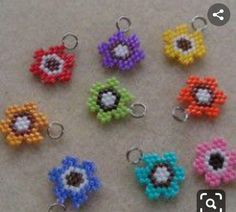 six beaded flower charms in different colors