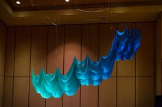 blue paper streamers hanging from the ceiling