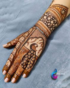 the hand is decorated with intricate designs