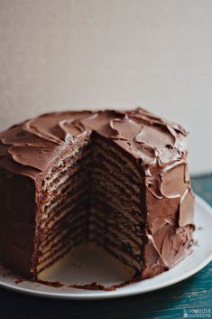 a chocolate layer cake on a white plate