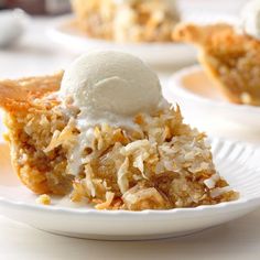 there is a piece of pie on the plate with ice cream on top and other desserts in the background