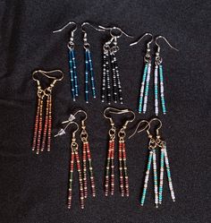 You'll fall in love with these modern seed bead dangle earrings!  Both strands of fringe are a bit different adding to the visual interest of the earrings.  Every pair is multi color, some being Ombre, are lightweight, and made from quality Toho beads.  The silver earrings are stainless steel, which is naturally hypoallergenic and non-corrosive, and the gold earrings are 18K plated. The beaded part of the earrings are 1 3/4", total length 2 3/4" Color options are in the same order as the photos. Seed Bead Fringe Earrings, Bead Fringe Earrings, Ombre Earrings, Bead Dangle Earrings, Bead Fringe, Stick Earrings, Beaded Earrings Diy, Toho Beads, Wire Jewelry Designs