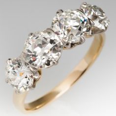 three stone diamond ring in yellow gold