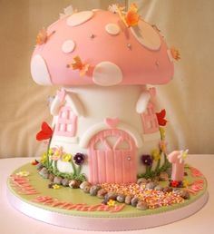 a cake that looks like a mushroom house