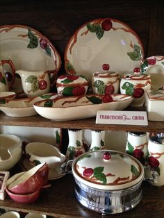 an assortment of dishes and bowls on display