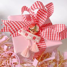 a pink and white box with a happy birthday ribbon on it