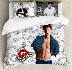 an image of a shirtless man on a bed with two pillow cases and pillows