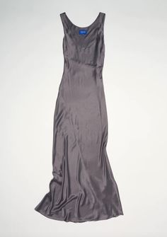 A heavenly yet understated floor length satin dress with low front scoop neckline and panelling throughout creating perfect drape.    material    81% triacetate 19% polyester    color    slate    size    product measurements: bust waist hip length    xs: 31.10 25.98 35.43 58.27    s: 33.07 27.95 37.40 58.27    m: 35.04 29.92 39.37 58.27    l: 37.01 31.89 41.34 58.27    xl: 38.98 33.86 43.31 58.27    origin    made in melbourne australia Sleek Silk Floor-length Slip Dress, Silk Maxi Dress In Solid Color, Sleek Silk Maxi Dress With Bias Cut, Solid Silk Bias-cut Maxi Dress, Solid Silk Bias Cut Maxi Dress, Permanent Vacation, Black Tank Dress, Black Aviators, Neon Purple