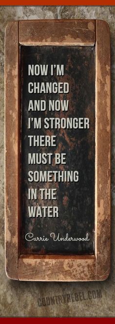 a sign that says now i'm changed and now i'm stronger there must be something in the water