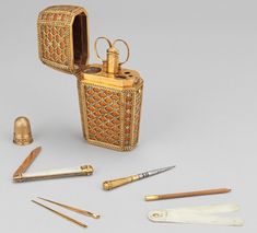 an antique gold flask and other items