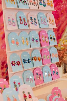 there are many earrings on display in the store