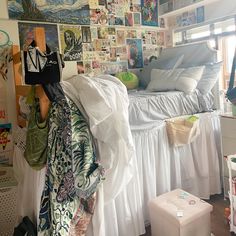 a bed room with a bunch of pictures on the wall