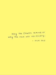 a yellow wall with a quote on it that says, may the flowers remind us why the rain was necessary