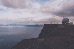 a telescope on top of a mountain overlooking the ocean