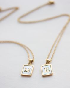 Initial Tag necklace in 14k gold filled with mother of pearl. A personalized necklace that makes the perfect gift for best friends, mother, sisters. Choose your initial or symbol and offer a meaningful gift. Please contact us for more initials. ♥ The chain is made of 14k gold filled and the tag 14k gold over stainless steel. The tag measures 1.2 cm x 1.6 cm. ♥ All of our items come in a lovely gift packaging. ♥ The necklace measures 18 inches long.  * ADD a gemstone on your necklace: http://etsy Personalized White Necklace With Square Pendant, Personalized White Square Pendant Necklace, White Initial Pendant Charm Necklace For Mother's Day, Elegant White Charm Necklaces As Gift For Mom, White Minimalist Initial Necklace As Gift, Elegant White Charm Necklace As Gift For Mom, Elegant White Charm Necklace For Mom, 14k Gold Engraved White Necklace, White 14k Gold Engraved Necklace