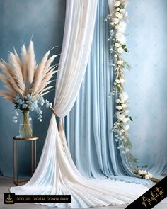 a blue and white wedding backdrop with flowers