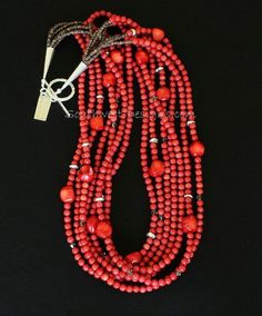 This vivacious Necklace displays a cascade of Bamboo Coral Rounds in appealing coral-red hues. The stones are 5mm in dimension, beautifully shaped, and polished to a glossy sheen. The Coral Rounds are paired with 10-by-13mm Coral Nuggets, adding visual interest to the design. Each Nugget is unique in shape, with subtly faceted and rounded edges. The combination is both classy and timeless — a great way to get your Western on! We've highlighted the Bamboo Coral with 4mm translucent gray Swarovski Elegant Red Hand-strung Jewelry, Elegant Adjustable Red Coral Beaded Necklaces, Elegant Adjustable Red Coral Beaded Necklace, Elegant Hand-strung Red Beaded Necklaces, Elegant Red Hand-strung Beaded Necklaces, Red Double Strand Beaded Necklace With Faceted Beads, Red Double Strand Faceted Beaded Necklace, Red Hand-strung Multi-strand Jewelry, Red Double Strand Faceted Beaded Necklaces