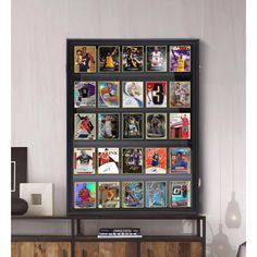 a wall with many pictures on it and a shelf in the corner next to it