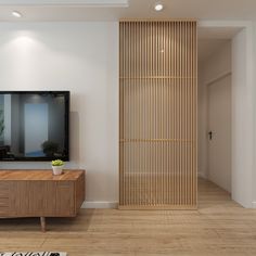 a flat screen tv sitting on top of a wooden cabinet next to a wall mounted television