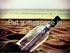 a message in a bottle sitting on the sand at the beach that says, still a message in a bottle