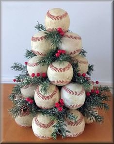 a christmas tree made out of baseballs and pine cones