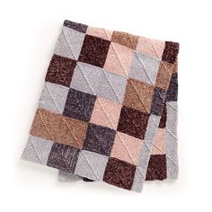 a brown and white checkered blanket on top of a table