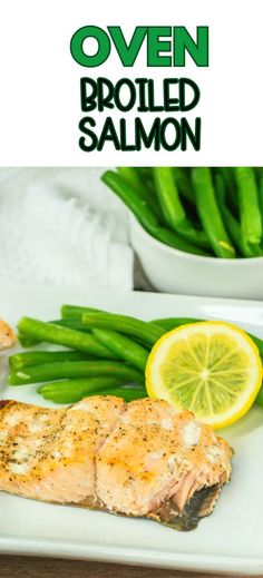 grilled salmon on a white plate with green beans and asparagus in the background