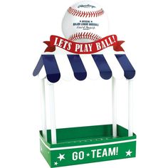 a baseball is sitting on top of a stand with a sign that says let's play ball