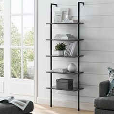 a living room with a couch and book shelf