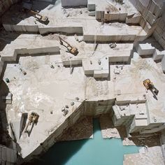 an aerial view of a construction site with water