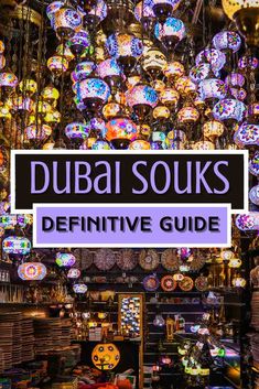 a store with lots of colorful lights hanging from it's ceiling and the words, dubai