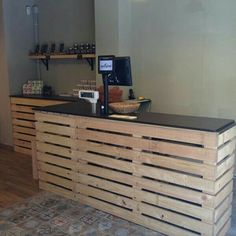 a bar made out of wooden pallets in a room