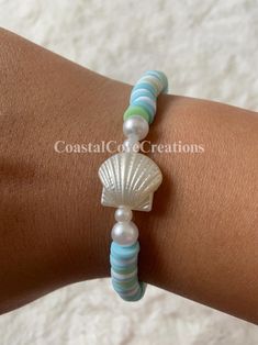 New bracelet ALERT️ Introducing the new collection of SUMMER 🌊 bracelets at Coastal Cove Creations!😉 With so many new designs and choices, I know that YOU can find a piece of jewelry that your heart desires.❤️ My bracelets can make any outfit stand out among the rest!🤩 * * * * * ✨Bracelet size is 6.5 inches✨ NOTE: My bracelets are able to stretch!! This means it can comfortably fit sizes 6-7 inches!🫧 * * * * * BRACELET CARE 🐣 Dos and Don'ts of bracelet care! DOS - Be careful with it! 🥰  - Wear it!! Everyone looks great with bracelets - Find a safe place for it when you are not wearing it! Keep away from pets and small children! 🐶 🐱 👶 DON'TS - Cut it ✂️  - Eat it 👄  - Overstretch it 🖐️  - Get it very dirty (can stain the beads and won't come off) 💦  ⚠️ PLEASE READ THIS!! ⚠️ If y Bracelets Summer, Shell Island, Clay Bead Bracelet, Beach Bracelet, Bracelet Summer, New Bracelet, Beach Bracelets, Summer Bracelets