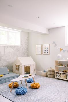 a child's playroom with toys and furniture