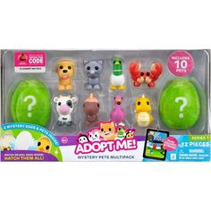 an assortment of animal toys in a plastic package with the words adopt me on it