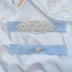 Introducing our exquisite Wedding Bridal Garter, the perfect touch of elegance and charm for every bride on her special day. This stunning wedding garter is not only a beautiful addition to your bridal attire but also a thoughtful and cherished gift for any bride-to-be. Ideal for bridal showers and bachelorette parties, this delicate piece will surely make the bride feel extra special and loved. Our Wedding Bridal Garters are meticulously crafted with high-quality materials to ensure comfort and Adjustable Elegant Wedding Sets, Elegant Adjustable Wedding Sets, Blue Lace Wedding Sets, Bridal Shower Gift Ideas, Perfect Bridal Shower Gift, Bride Garter, Bridal Garters, Garter Wedding, Bride Attire