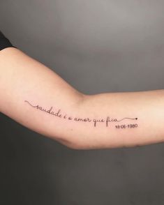 a woman's arm with a quote on it