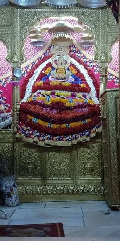 the interior of a temple with gold and red decorations