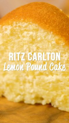 a close up of a piece of cake on a wooden table with the words ritz carlton lemon pound cake