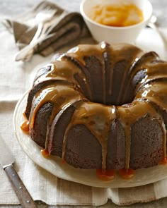 a bundt cake on a plate with caramel sauce