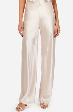 Fall for the sleek silhouette of these night-out pants designed with a high waist and crafted from glossy satin. 31" inseam; 21 1/2" leg opening; 11 1/2" front rise (size Small) Unlined 73% acetate, 27% polyester Dry clean Imported White Satin Pants Outfit, White Satin Pants, Satin Pants Outfit, Cami Nyc, Satin Pants, Silk Trousers, Womens Cami, Trouser Pants Women, Maternity Shops