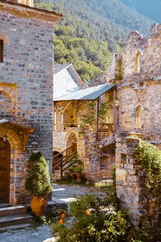 an old stone building with steps leading up to it