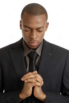 a man in a suit and tie is praying