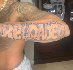 a man with a tattoo on his arm that reads'abandoned'in large letters