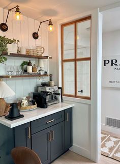 a kitchen with a counter and some lights