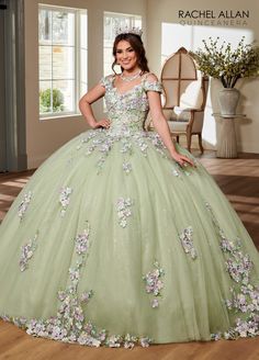 Be a trendsetter in this 3D floral applique long cold shoulder dress with A-line skirt by Rachel Allan RQ1125. Glitter tulle quinceanera ball gown features V-neckline, off-the-shoulder straps, 3D flowers, and lace-up back closure. 3D Floral Cold Shoulder Quinceanera Dress by Rachel Allan RQ1125 Rachel Allan Carmina Collection: Fall 2023 Style Number: RQ1125 Fabric: Tulle, Glitter Tulle, Applique, 3D Flowers Please note: There may be a loss of glitter while wearing this dress due to the nature of Floral Ballgown, Green Quinceanera Dresses, Debutante Ball, Quince Dress, Cold Shoulder Styles, Corset Dress Prom, Rachel Allan, Quinceanera Dress, Ball Gown Skirt