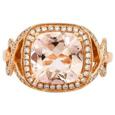 This collection features an array of magnificent morganites! Accented with diamonds these rings are made in rose gold and present a classic yet elegant look. Classic morganite ring in 18K rose gold with diamonds. Morganite: 3.68 carat cushion shape. Diamonds: 0.348carat, G colour, VS clarity. Gold: 5.14g, 18K rose gold. Ring Size: US 6.75 - Size can be adjusted for free upon request - please reconfirm with your order. R474 Luxury Rose Gold Diamond Ring With Gemstone, Luxury Morganite Diamond Ring With Diamond Accents, Luxury Morganite Diamond Ring With Accents, Luxury Morganite Diamond Ring With Prong Setting, Luxury Morganite Diamond Ring For Anniversary, Luxury Rose Gold Rings With Accent Stones, Luxury Morganite Ring With Prong Setting, Elegant Morganite Ring For Formal Occasions, Elegant Rose Gold Topaz Ring With Accent Stones