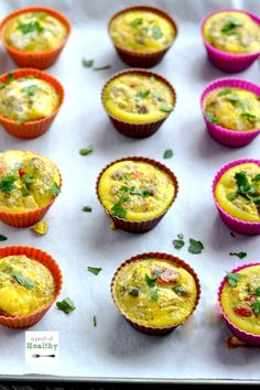 there are many small muffins on the baking sheet, ready to be eaten