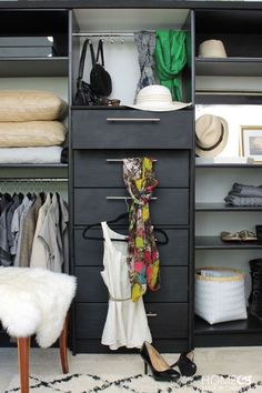 an organized closet with clothes and shoes